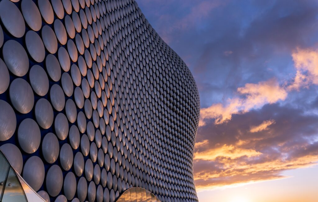 A view of the Selfridges building in Birmingham, England, featuring its iconic design and unique reflective surface.
